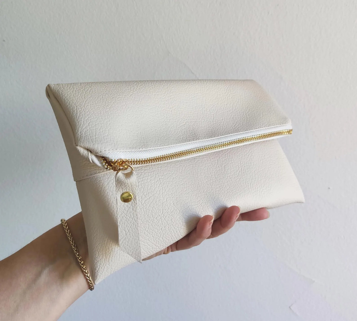 Fold over clutch in cream