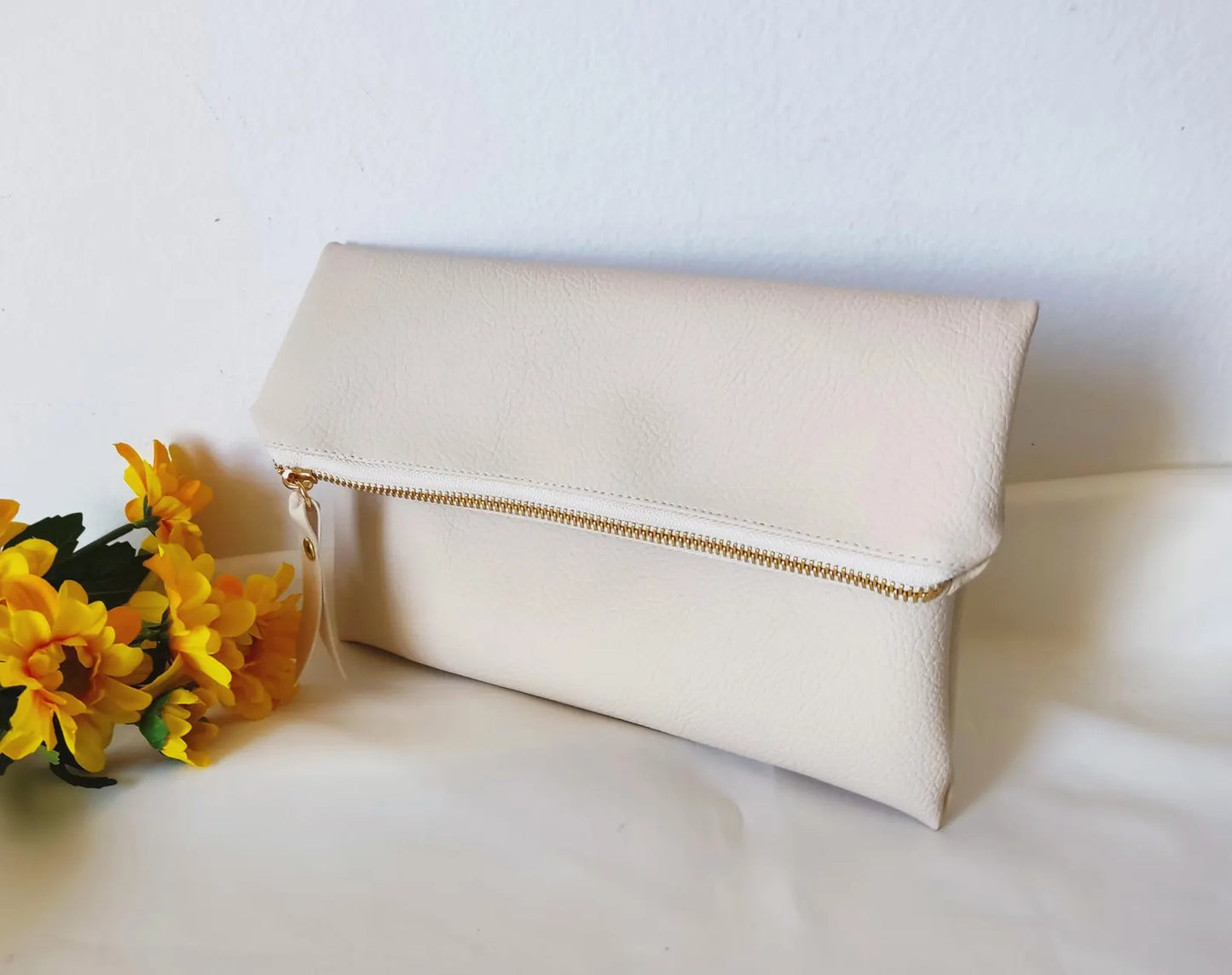 Fold over clutch in cream