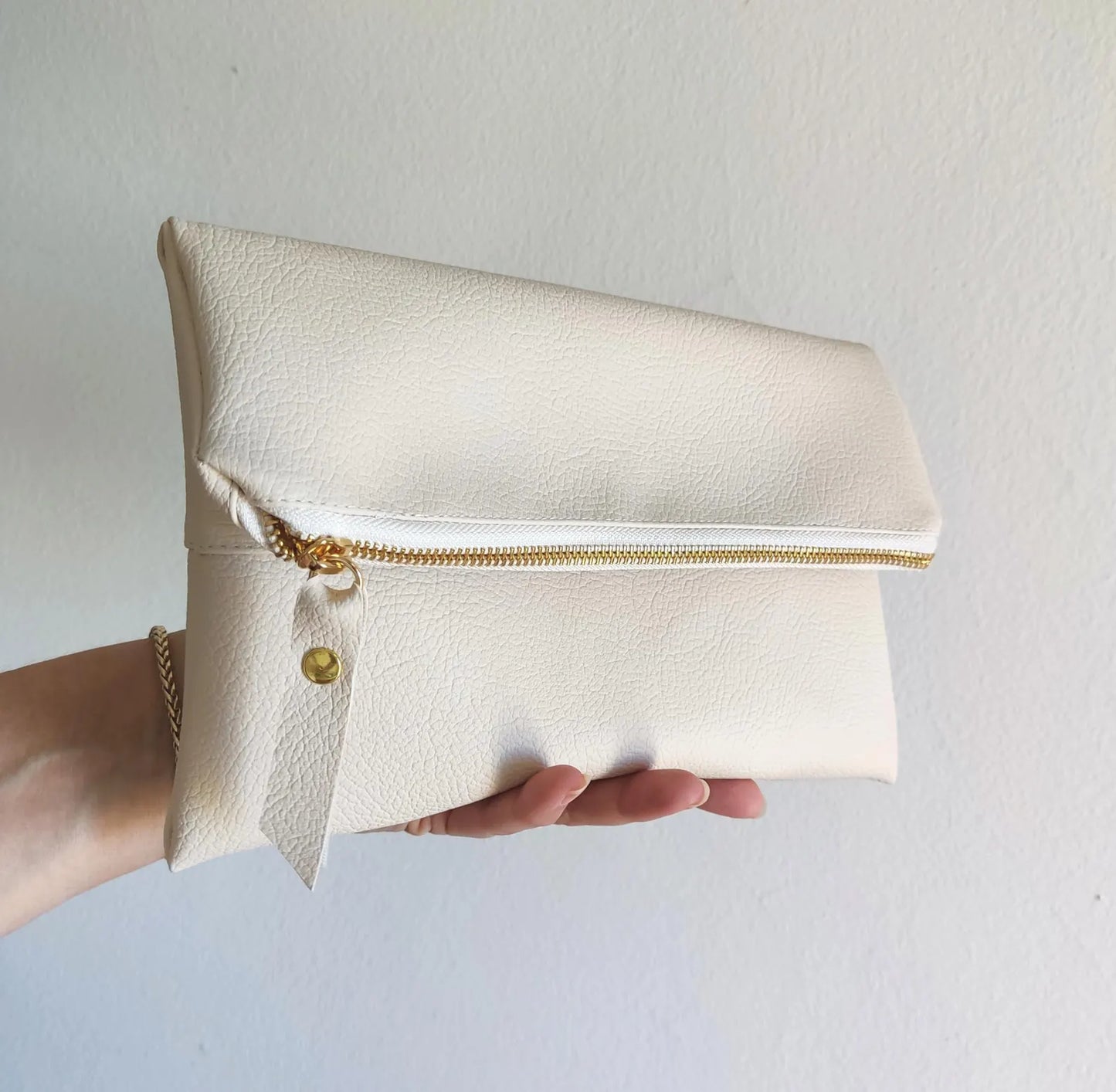 Fold over clutch in cream