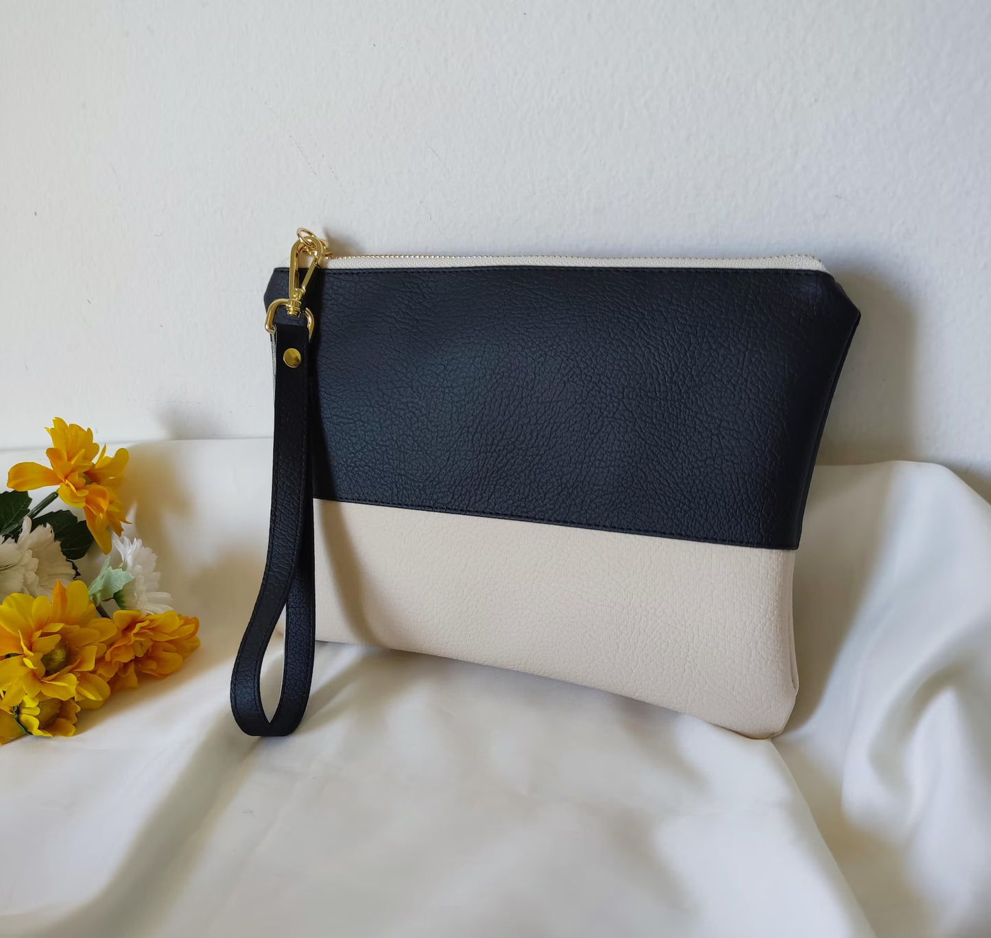 Two-tone clutch bag with a picture and message inside