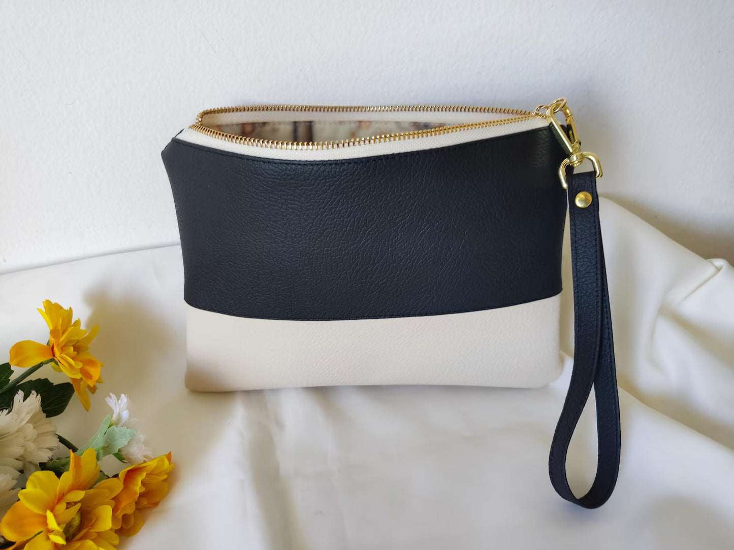 Two-tone clutch bag with a picture and message inside