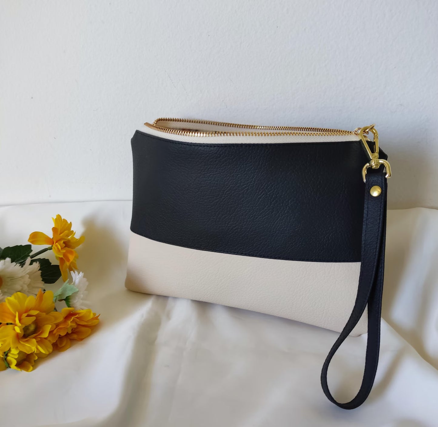 Two-tone clutch bag with a picture and message inside
