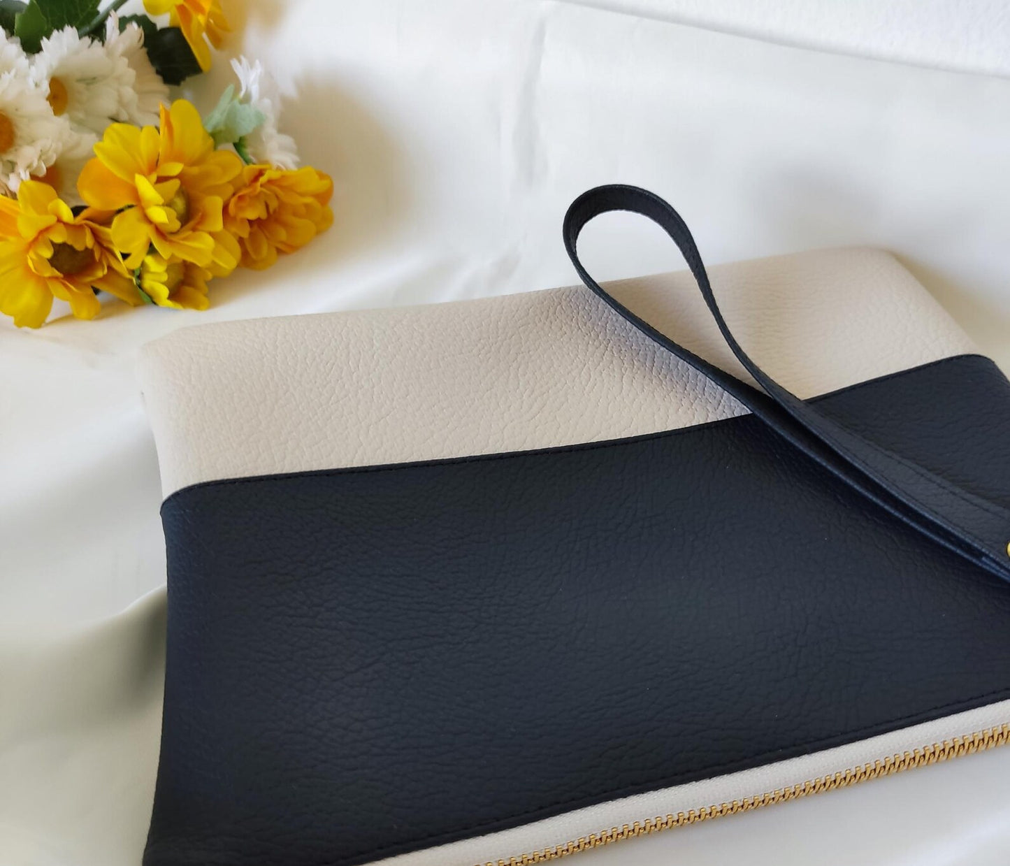 Two-tone clutch bag with a picture and message inside